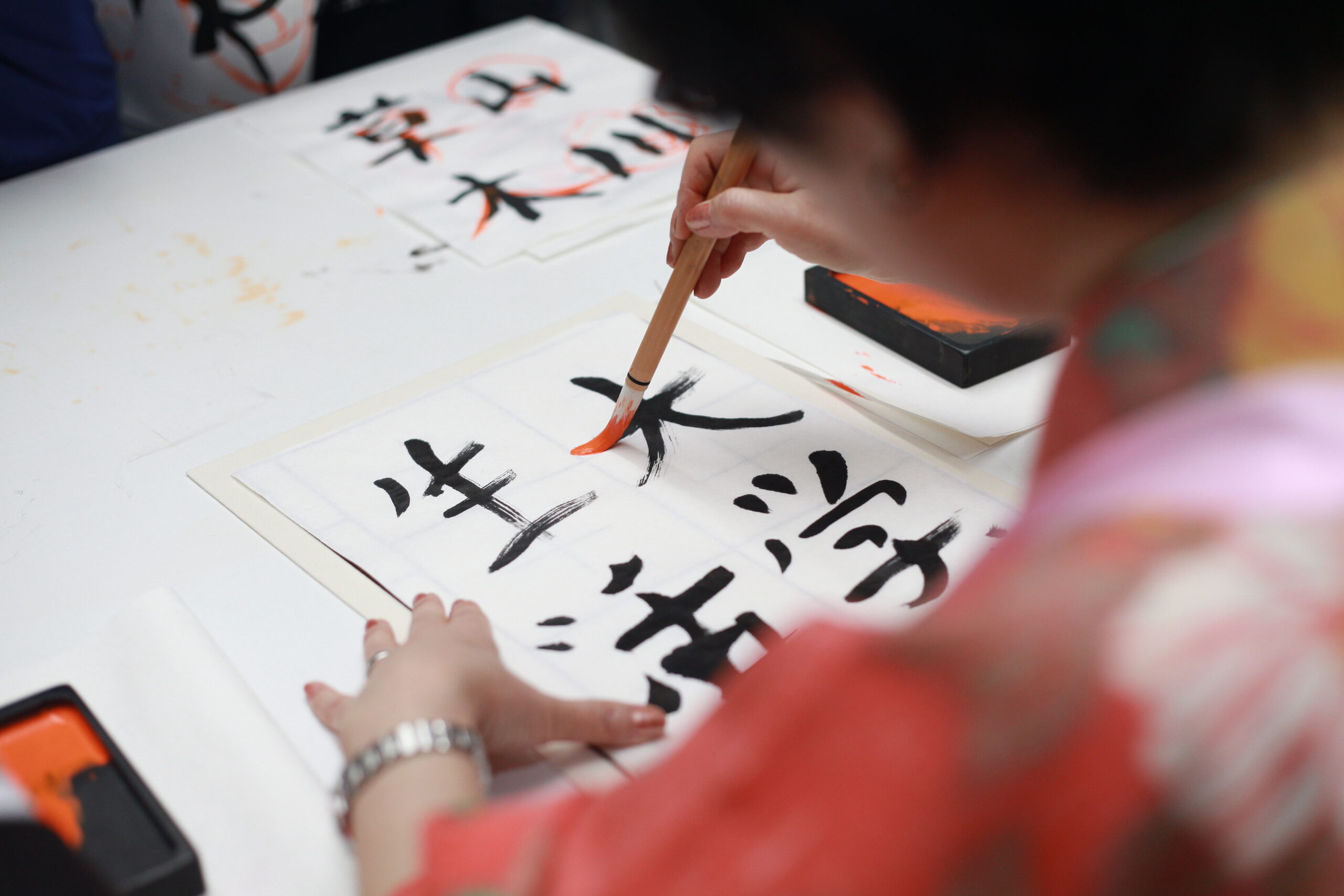 woman-drawing-oriental-symbols
